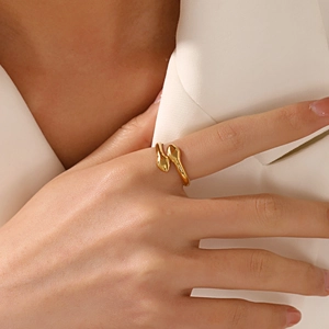 Minimalist double-headed snake ring in 18K gold plated stainless steel worn by model