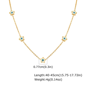 Detail view of gold necklace with star-shaped evil eye charms including size measurements
