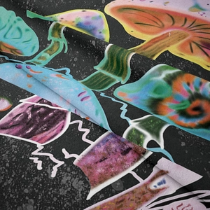 Detailed close-up of textured fabric showing vibrant mushroom prints on a dark background