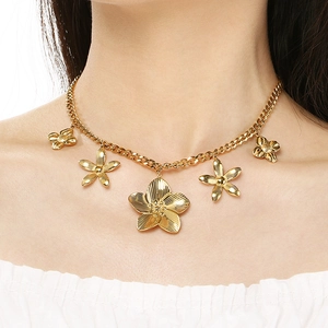 Elegant gold stainless steel flower pendant necklace shown on female model neck