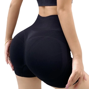 High-waisted seamless black yoga shorts with honeycomb texture and push-up effect