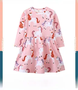 Detail of pink cotton long-sleeve toddler dress featuring colorful unicorn patterns