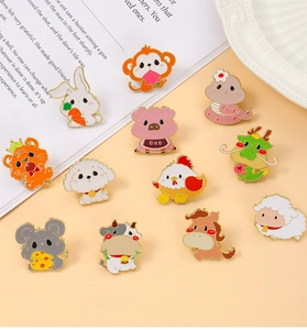 Detailed view of twelve cute zodiac animal enamel pins arranged on a warm orange backdrop