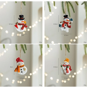 Detail of four retro resin snowman ornaments with size and weight on Christmas tree branches