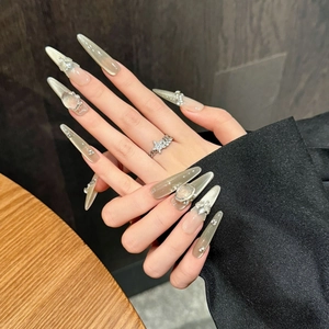 Sparkling grey-green cat-eye press-on nails with luxury crystals and almond shape