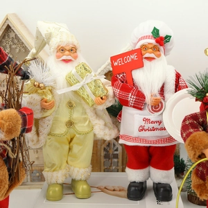 Figurines du Père Noël en paillettes dorées et tenue de chef pour décor de Noël festif