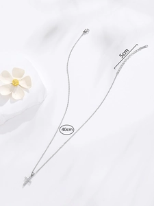 Detailed view of silver cross pendant with 40cm chain and 5cm extension scale