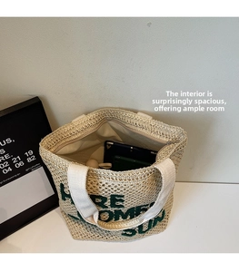 Detail of woven tote bag interior showing large capacity, zipper closure and inner lining