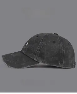 Detail of vintage washed cotton baseball cap featuring high-quality mountain embroidery