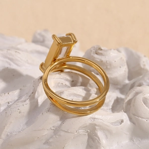Double layered 18K gold plated stainless steel ring featuring a rectangular crystal stone