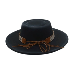 Detail of the woven ethnic band and brown leather bow on this black wool felt hat