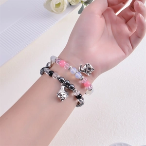 Magnetic heart bracelets with wizard hat and cat charms on beaded elastic crystal bands