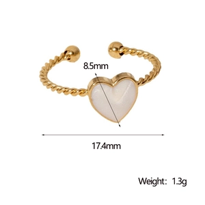 Detailed view of golden twisted band ring with white heart inlay and size measurements