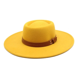 Detail of yellow wool felt fedora featuring 9.5cm wide brim and brown leather band