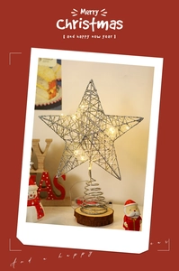 Detail of silver LED star topper with spiral stand and wooden base for Xmas decor