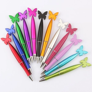 Collection of colorful butterfly ballpoint pens in metallic and pearlescent finishes