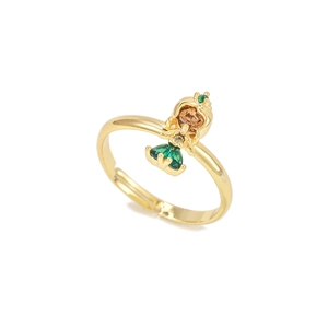 Detailed macro of golden adjustable fairy ring with colorful zircon stones on white background