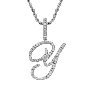 Macro detail of iced-out letter Y pendant with shimmering zircons and silver rope chain