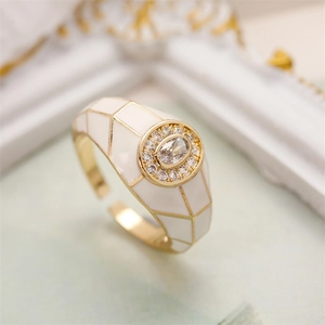 Detailed close-up of 18K gold-plated adjustable ring with white enamel and oval zircon gem