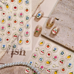 3D fruit and floral nail art stickers with gold outlines and embossed tulip patterns
