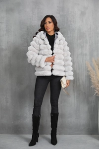 Detail of light gray faux fur jacket showing the horizontal ribbed texture and plush material