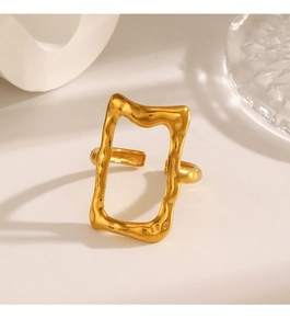 Detail of gold-plated rectangular hollow ring with handcrafted hammered texture finish