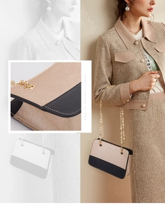 Detail of contrast color leather backpack with elegant metal chain and tweed fabric texture