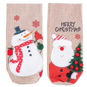 Christmas burlap wine bottle bags featuring Santa and snowman patterns for holiday decor