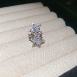 Macro shot of silver star ear cuff featuring sparkling cubic zirconia pavé stones