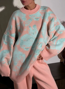 Close-up of pink and blue marble pattern knit sweater showing premium fabric texture