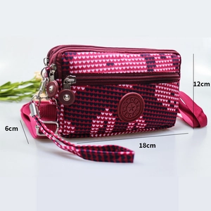 Women's heart pattern crossbody phone bag with multi-layer zippers and sport logo