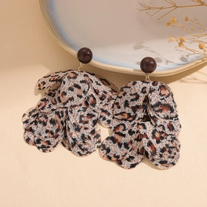 Macro shot of chiffon petal earrings with leopard print and vintage brown beads