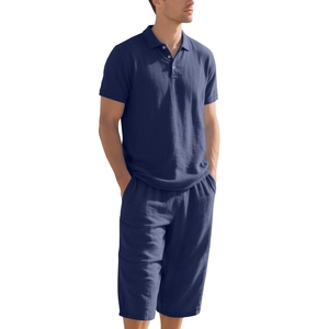 Detail view of the deep blue breathable cotton linen texture on men's polo shirt and shorts