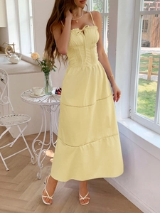 Elegant yellow sleeveless maxi dress with tiered skirt for women's casual vacation style