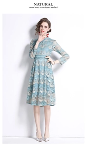 Detailed embroidery on light blue lace dress featuring high waist and floral cutouts