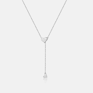 Detail of 925 silver lariat necklace featuring a polished heart pendant and thin chain