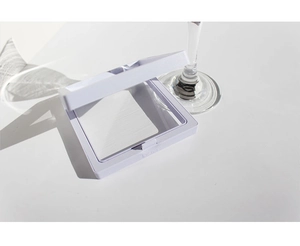 Macro shot of an open white square PE film jewelry storage box with aesthetic shadows