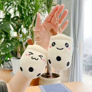 Detail of cute pearl milk tea plush keychains with cartoon embroidery and golden rings