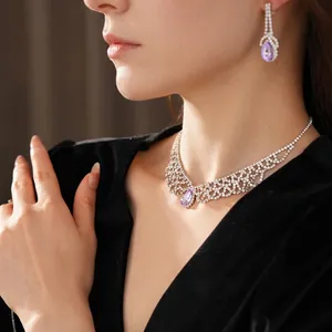 Luxury silver jewelry set with purple teardrop crystals and sparkling micro-pave diamonds
