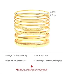 Detail view of 10-piece gold iron bangle set showing various textures and 6.8cm diameter