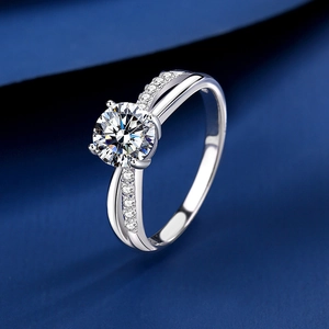 Elegant S925 sterling silver ring with four-prong round moissanite on blue silk fabric