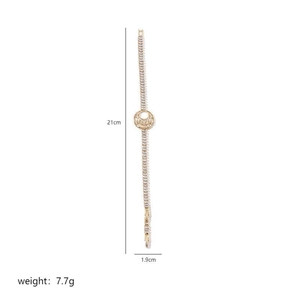 Gold moon bracelet with micro-pave crystals and detailed product size specifications