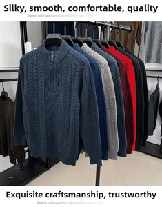 Detail of multi-colored half-zip knit sweaters with cable textures on display