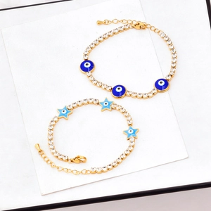 Golden titanium steel bracelet set featuring blue evil eye charms and sparkling zircon