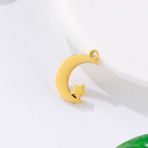 Polished gold stainless steel moon and star pendant necklace on a clean white background
