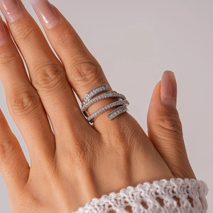 Macro shot of silver multi-layer crisscross ring with pavé-set clear cubic zirconia