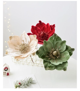 Velvet magnolia Christmas tree flowers with gold glitter accents in a wire basket