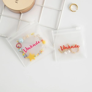 Frosted semi-transparent EVA jewelry bags with zipper showing colorful beaded bracelet