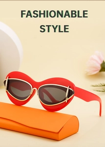 Detail of red cat eye sunglasses with gold hinges resting on an orange folding case
