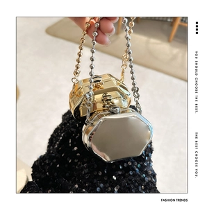 Close-up of octagon zinc alloy mini bag with spherical metal chain in gold and silver finish